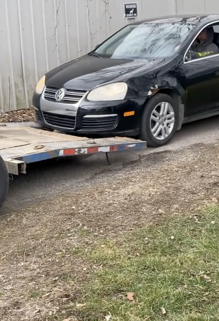 a car driving onto a trailer